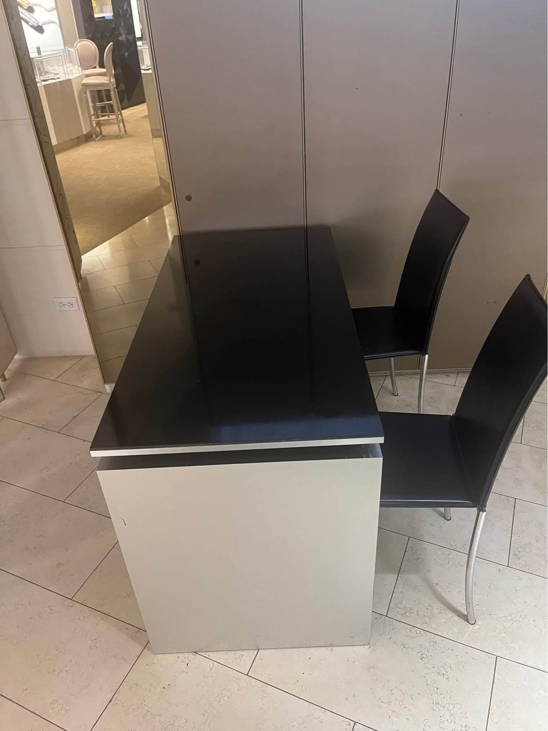 Black and white desk with 3 chairs